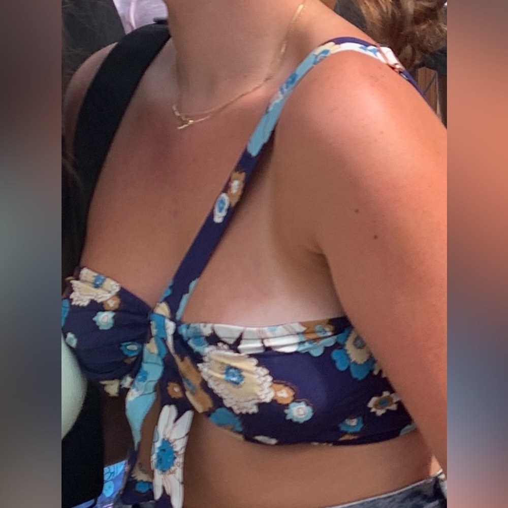 For love and lemons, one shoulder adjustable flower top